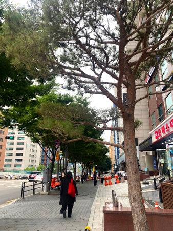 Unidentified people walking on street in Hong Kong. Hong Kong is one of the most visited tourist destinations in the world.の写真素材