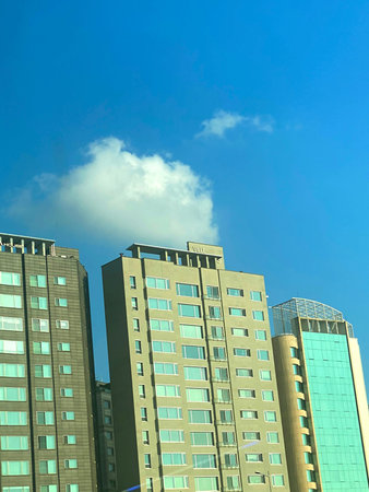 High rise building under the blue sky, closeup of photo.