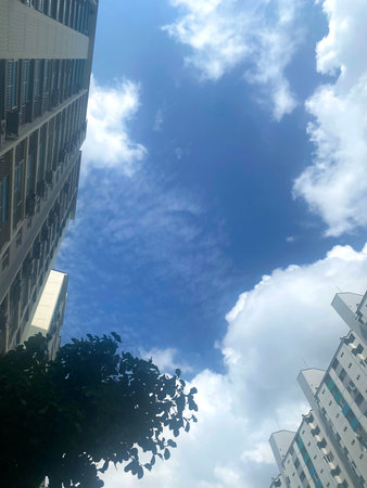 high rise building and blue sky with cloud in hongkong