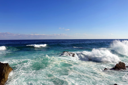 Waves breaking on the rocks in the Mediterranean Sea, Cyprus.の写真素材