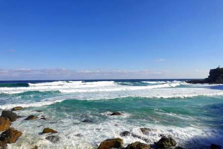View of the ocean waves breaking on the rocks in Tenerifeの写真素材