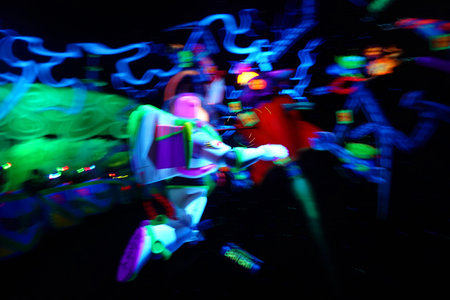 Neon light show in the night club. Motion blur effect.