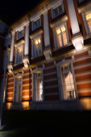 The facade of an old building at night. Blurred background.の写真素材