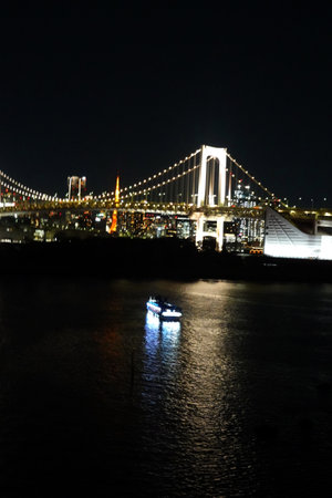 Night view of the Rainbow Bridge in Tokyo, Japan. The Rainbow Bridge is a suspension bridge that spans the Odaiba River.の写真素材