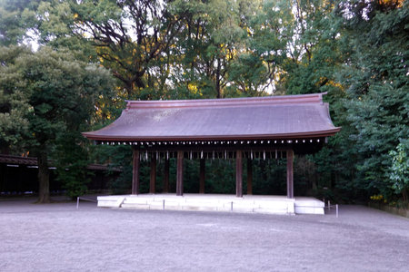 Wooden pavilion in the park with autumn trees in the backgroundの写真素材