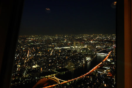 Night view of the city from the window of a flying car.の写真素材