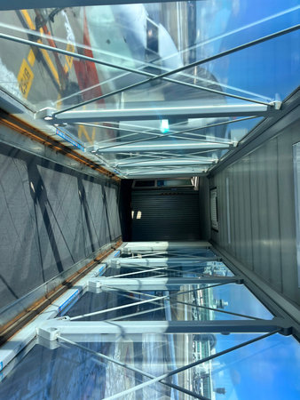 Interior of a modern office building with glass walls and metal elements