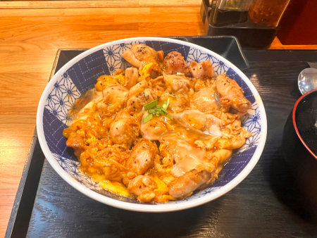 stir-fried rice with pork and vegetables in a bowlの写真素材