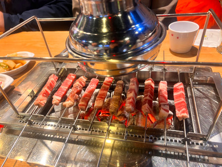Grilled beef on the grill with hot pot in the restaurant.の写真素材