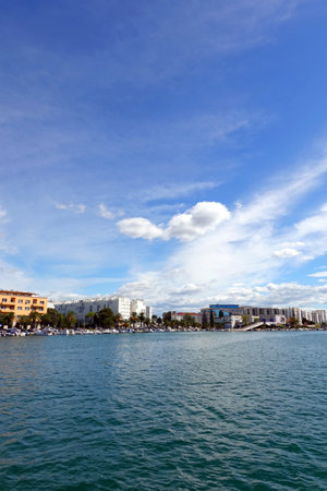 View of the city from the sea on a sunny dayの写真素材
