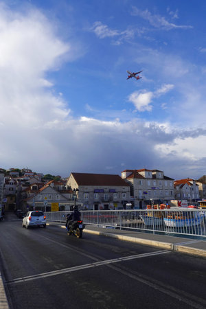 A motorcyclist flies over the city.