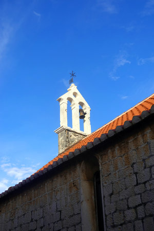 Church steeple against the blue sky, Croatia, Dalmatiaのeditorial素材