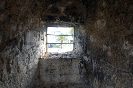 The window of an old castle in the city of Jerusalem in Israel