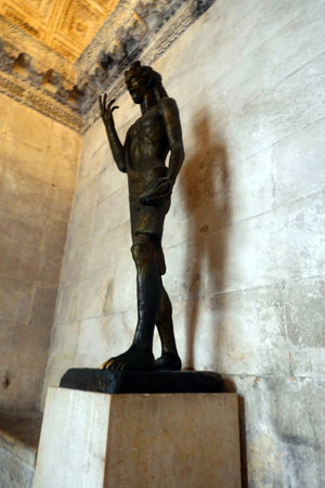 Sculpture of a man in the ancient city of Salamanca, Spainの写真素材
