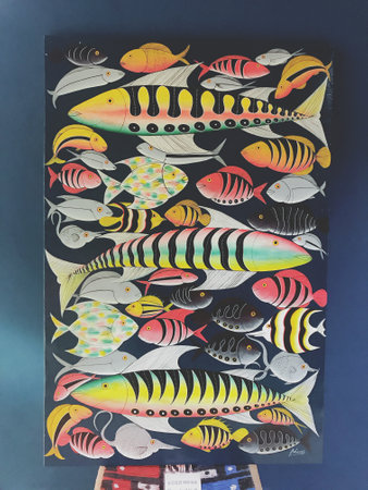 Colorful fish painting on the wall of a shop in Thailand.の写真素材