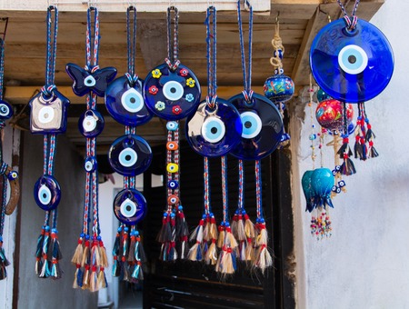 Evil eye bead souvenirs.broken glass is melted and shaped. In culture and religious belief, the figure of the eye is regarded as a powerful amulet protecting evil. It is a powerful talisman in Turkish culture.の写真素材