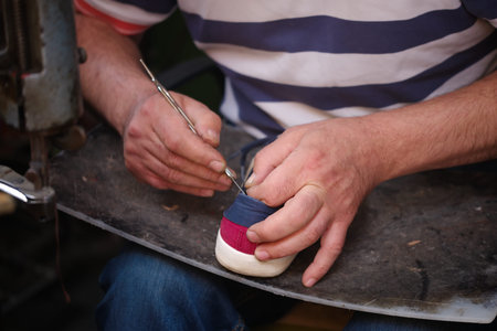 Cobbler. The master worker who repairs the shoe