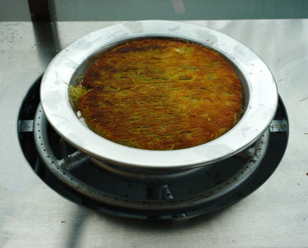 Gaziantep's famous crispy kunefe (kÃ¼nefe). Traditional turkish arabic dessert. Turkish flavor...