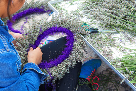 woman, doing crown with lavender flowers. lavender flowers are made by knitting with rope. Isparta /...