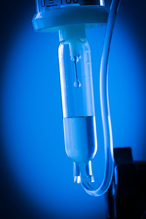 Close up saline solution blue backgroundの写真素材