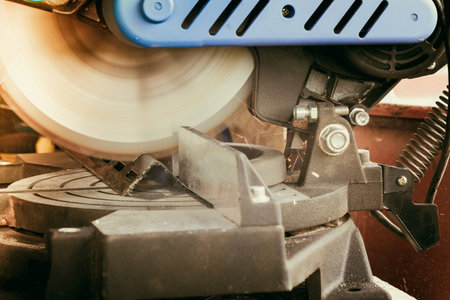 Close-up of Electric Grinder Cutting metal pipe with Bright Sparks tails