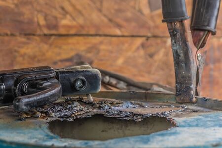 Finishing bad welding Process with blue tube metalの写真素材