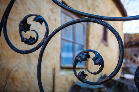 Old wrought iron gate, a beautiful curlsの写真素材