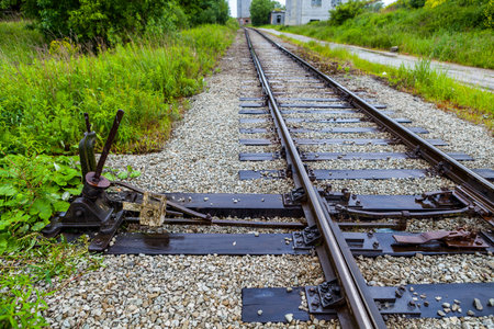 Manual railroad switch on old plant in Maardu, Estonia
