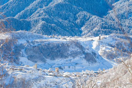 Mountain village on the snowy slope in Caucasus, Svanetiの写真素材
