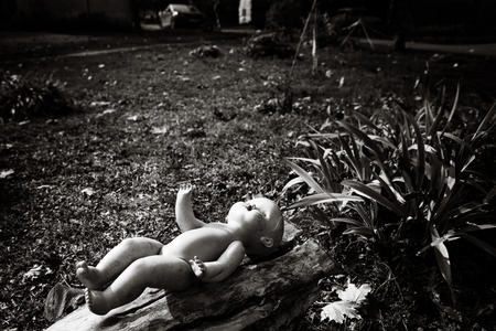 The lonely doll in urban scene, depression and hopelessness of life of urban suburbsの写真素材