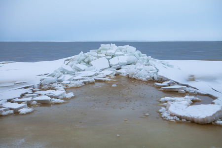 Ice on Baltic sea, cloudy dayの写真素材