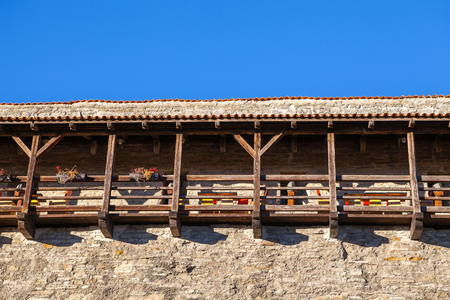 Medieval wall of old town with cafe in Danish King castle, Tallinn, Estoniaの写真素材