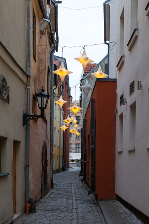 Narrow medieval streets of Old Riga decorated for Christmasの写真素材
