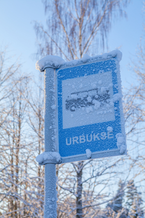 Covered with snow bus stop signの写真素材