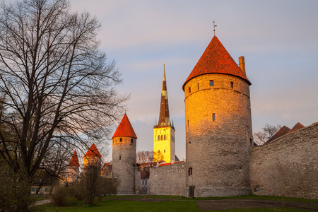 Sunset over towers of Old Town and Oleviste church of Tallinn In Estonia. Spring time.の写真素材