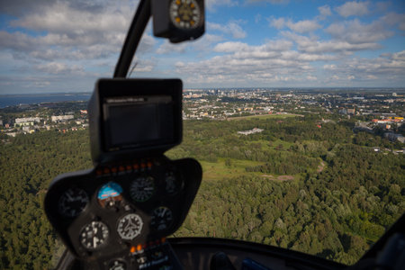 Flying over forest and blurred helicopter cockpit