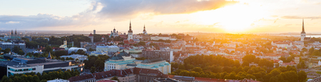 Colorful sunset over towers of old town of Tallinn, Estonia. Ultra wide panoramic viewの写真素材
