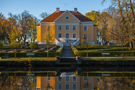 Rich manor with a park and a pond at sunrise. Palmse, Estonia.の写真素材