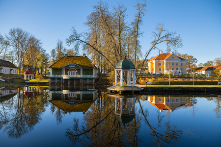 Manor with a pond, bathhouse and rotunda at sunrise. Palmse, Estonia.の写真素材