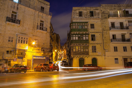 VALETTA, MALTA - OCTOBER, 20, 2016: Deep night traffic. Night cityscape. Close up.のeditorial素材