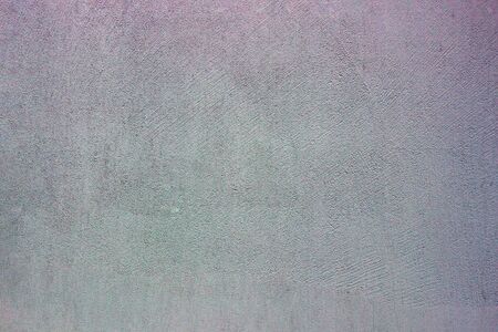 cement or concrete wall painted with colored textureの写真素材
