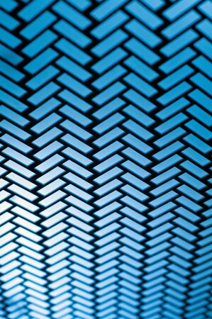 Herringbone pattern. Rectangles rounded corner slabs tessellation with white slant blocks tiling. Floor cladding. A regular type of electric lightの写真素材