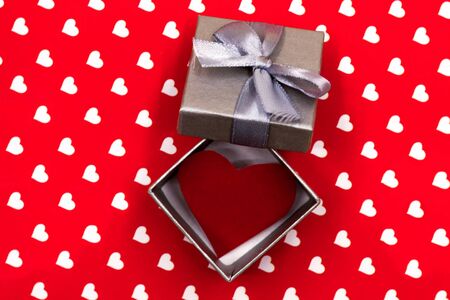 small gray gift box white red heart inside. Valentine's Day, wedding, love, happiness concept.の写真素材