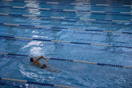 Competition swimming pool crowded of swimmers training