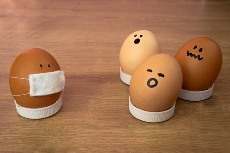 masked chicken easter egg. scared eggs avoid coronavirus infected. panic on face
