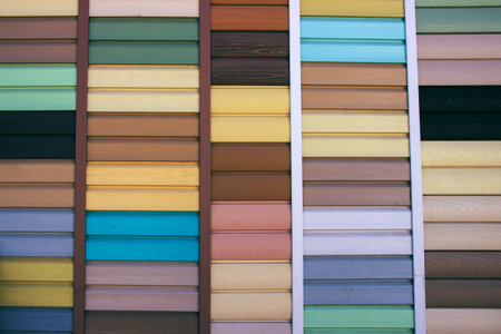 Siding made in the texture of wood close-up. variety of samples on display