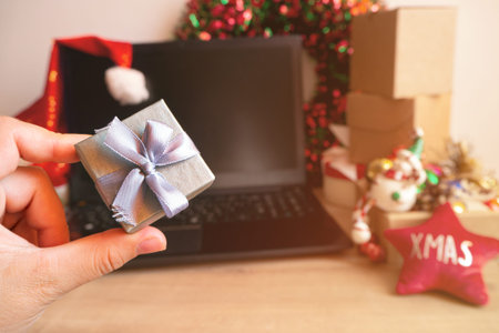 christmas shopping online with laptop, x-mas sale at home in holiday decor, close up