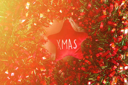 Flat lay composition with Christmas gifts and festive decor on brown backgroundの写真素材