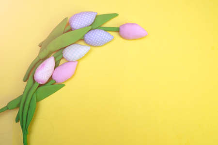 sewn fabric tulips. Hand made textile flower for lovers gift for Valentines Day or Womens Day. plants that do not require maintenance and Unfading flowers. layout with copy spaceの写真素材