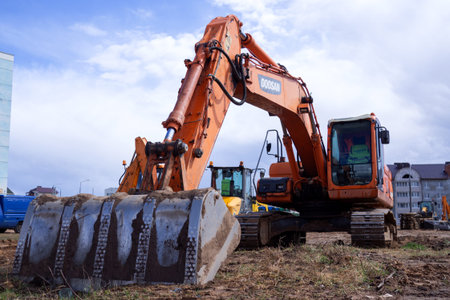 large crawler excavators standing at a construction site. excavators and bulldozers